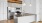 a kitchen with white cabinets