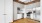 a kitchen with white cabinets